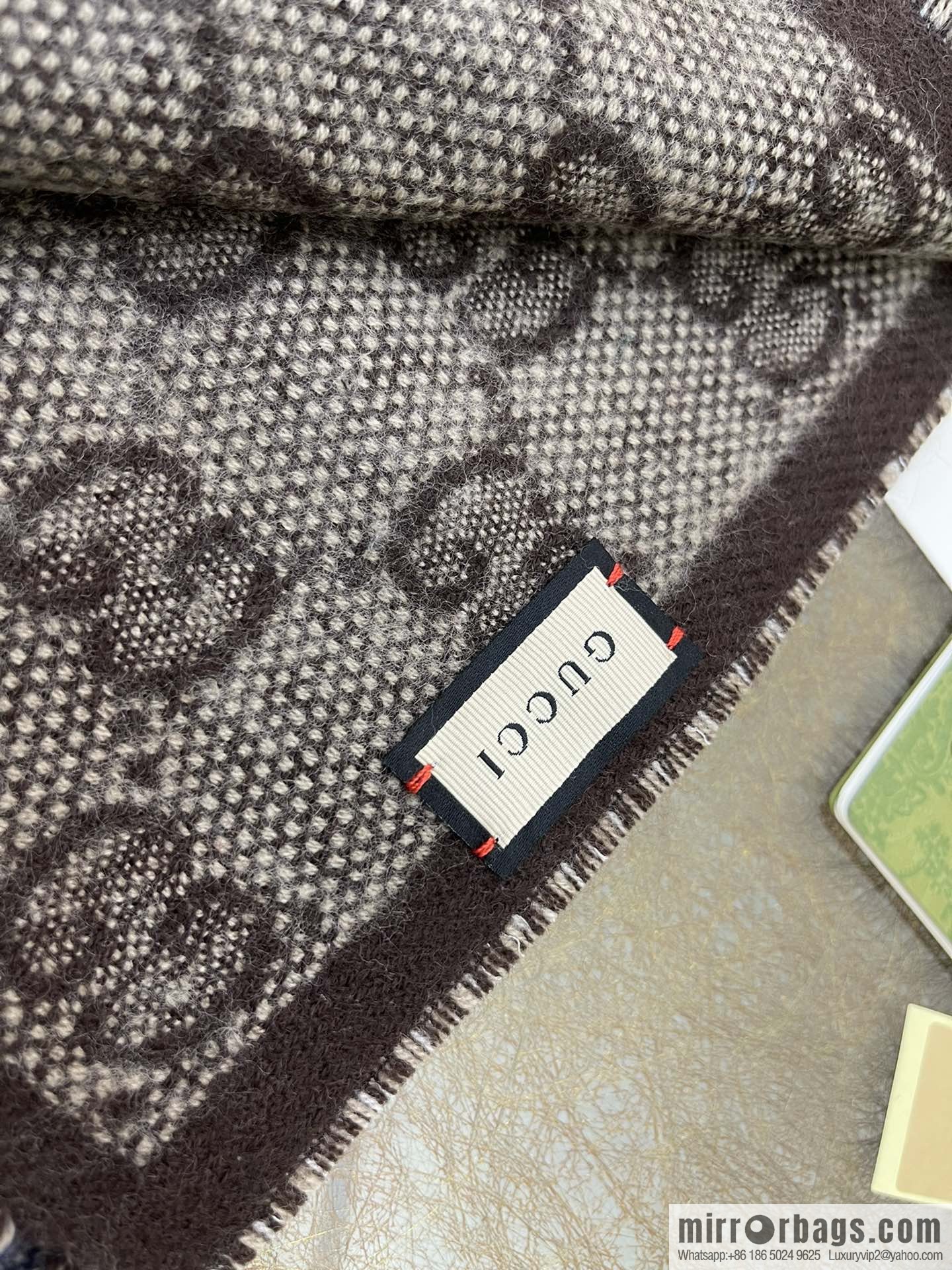 GUCCI Gucci GG pattern double-sided wool scarf 676610