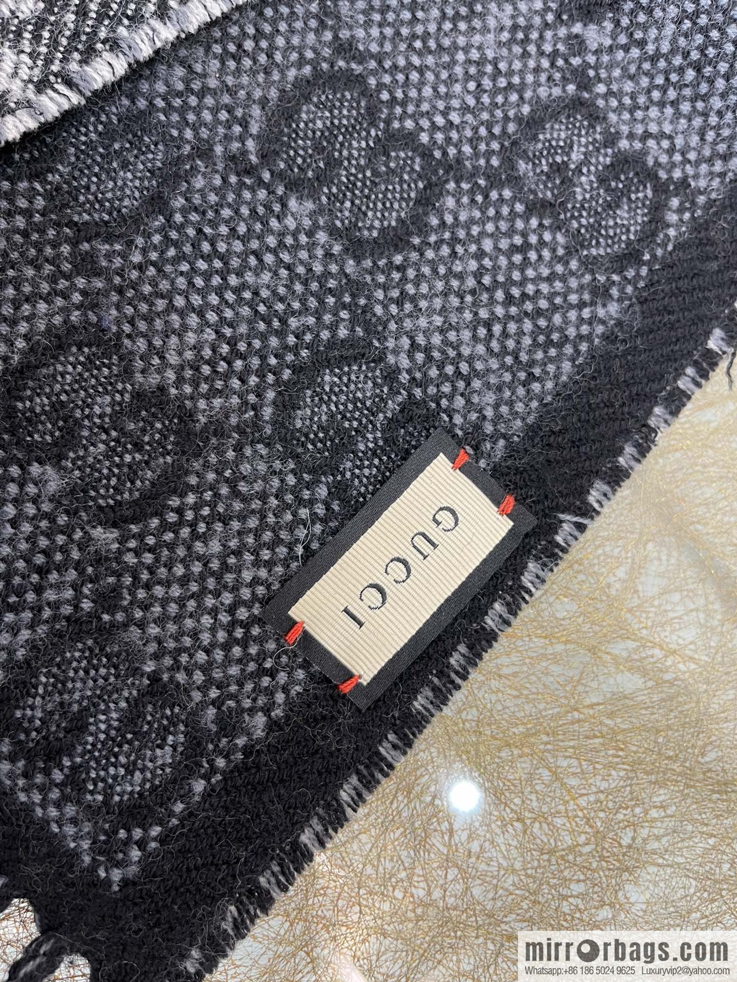 GUCCI Gucci GG pattern double-sided wool scarf 676610