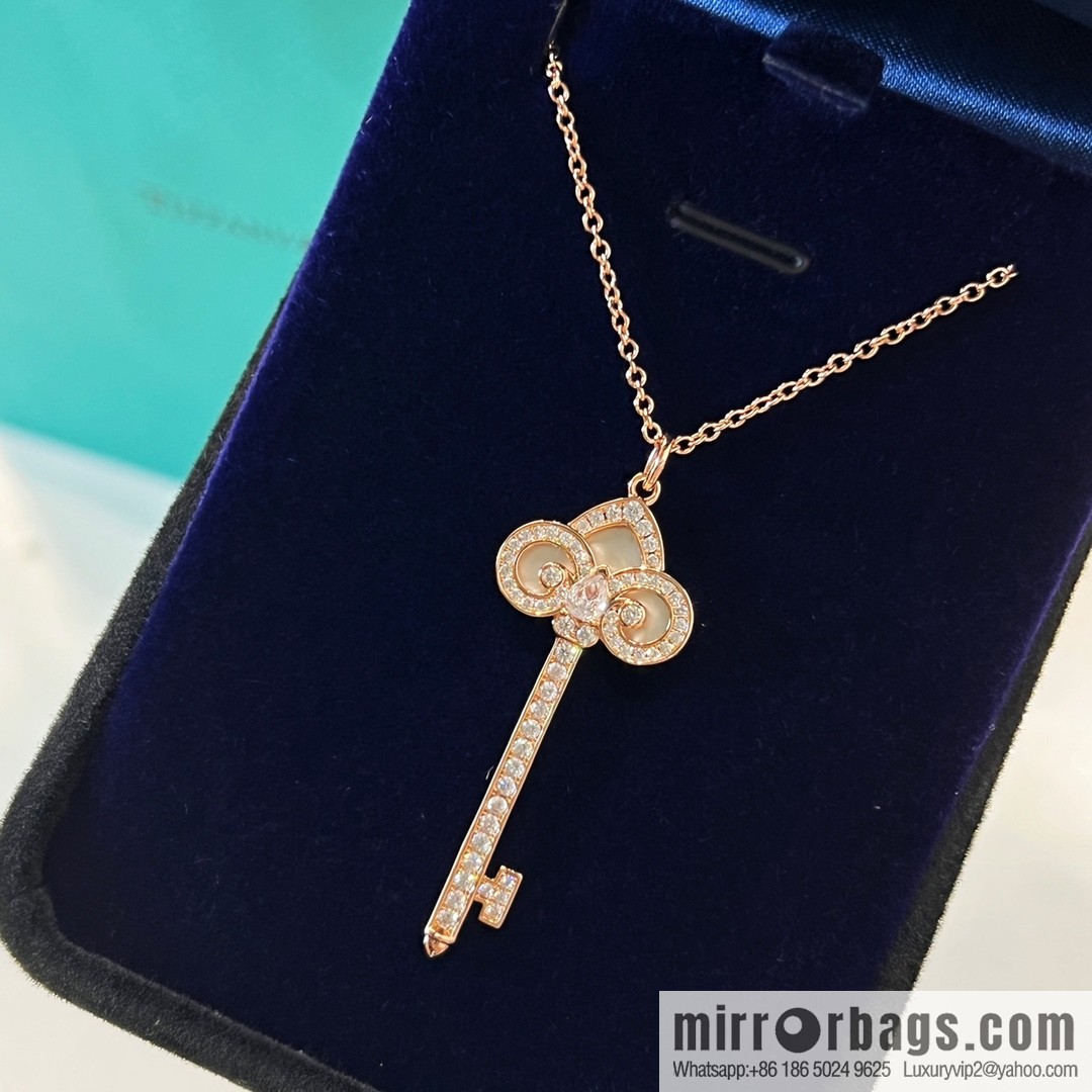 TIFFANY & CO. Tiffany & Co. Fleur de Lis white shell key pendant necklace