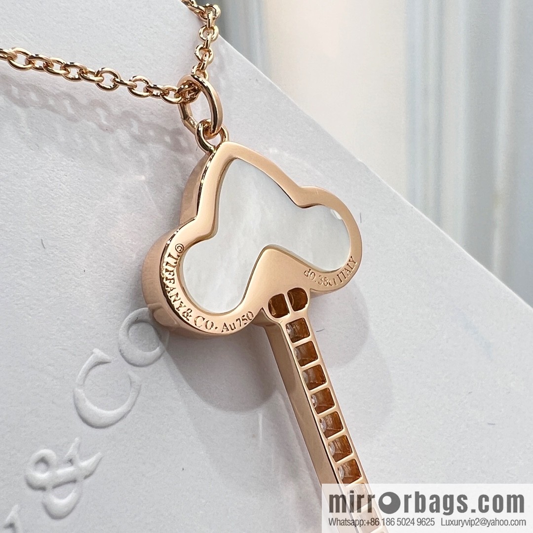 TIFFANY & CO. Tiffany & Co. Fleur de Lis white shell key pendant necklace