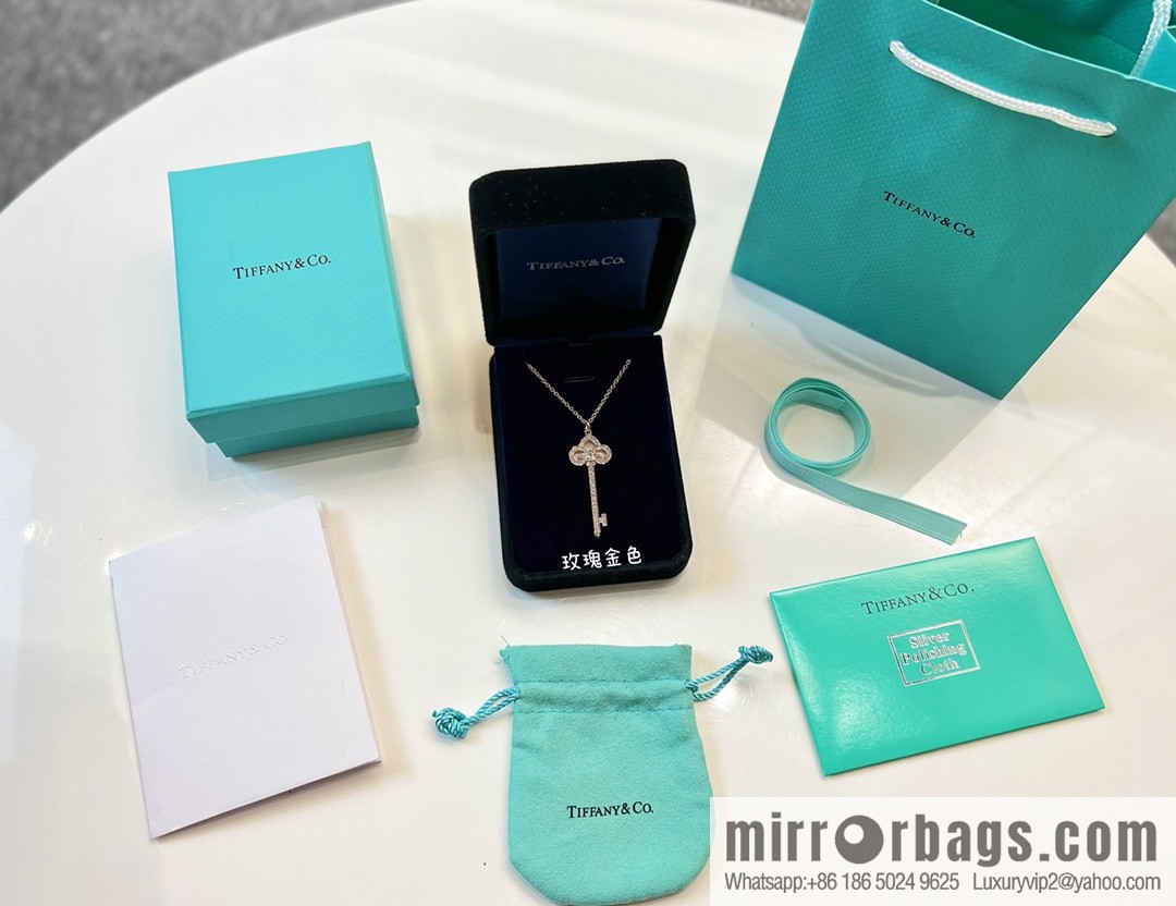 TIFFANY & CO. Tiffany & Co. Fleur de Lis white shell key pendant necklace