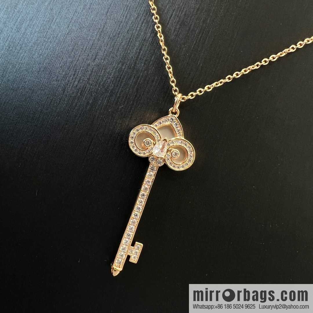 TIFFANY & CO. Tiffany & Co. Fleur de Lis white shell key pendant necklace