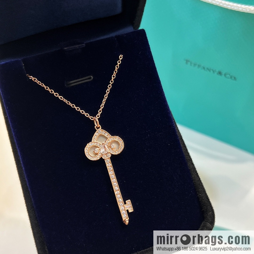 TIFFANY & CO. Tiffany & Co. Fleur de Lis white shell key pendant necklace