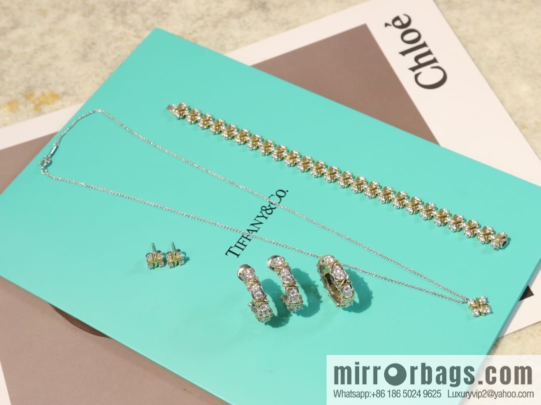 New ☑️ TIFFANY & Co. Tiffany & Co. Color separation cross stud earrings