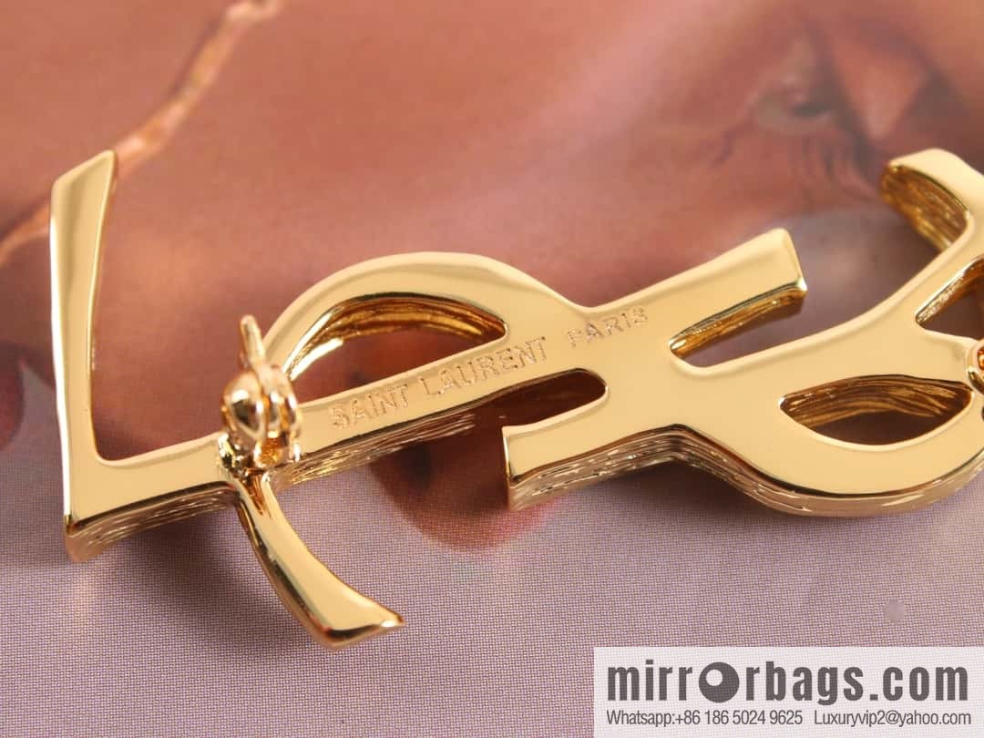 Saint Laurent gold YSL brooch