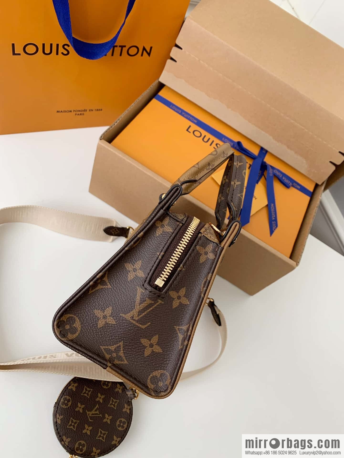 LV M46653 OnTheGo East West