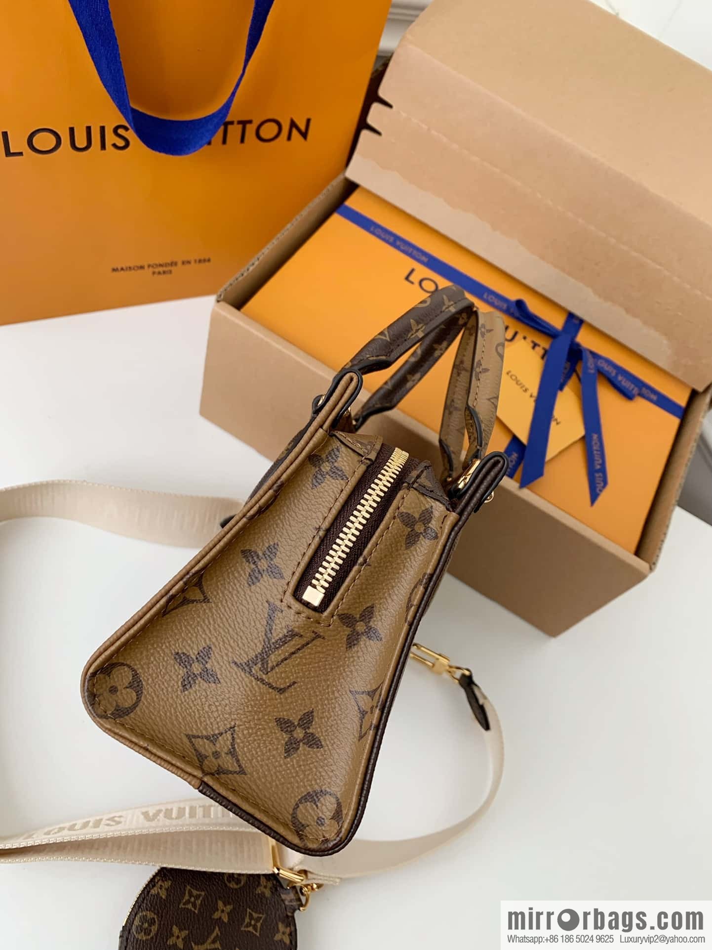 LV M46653 OnTheGo East West