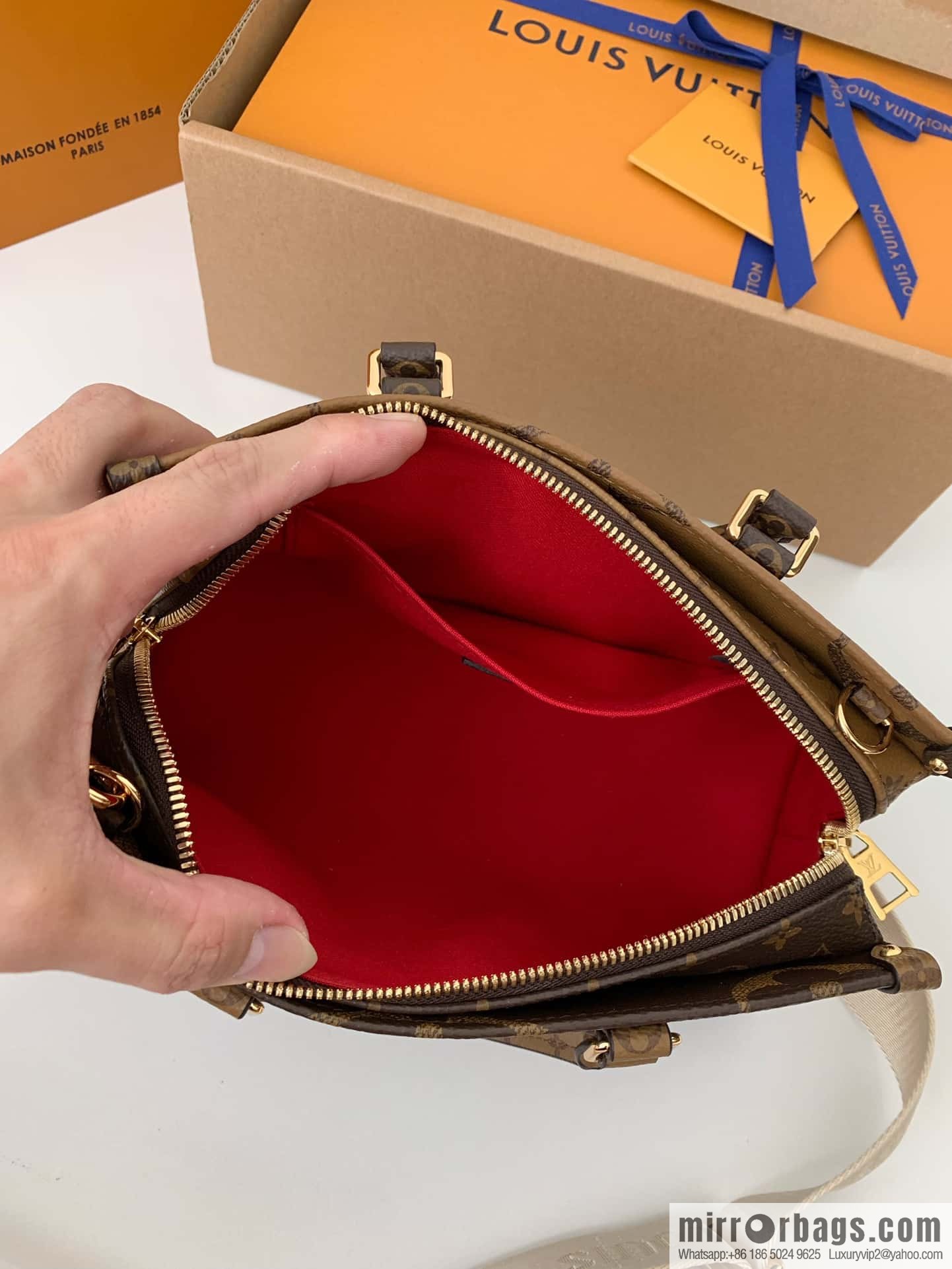 LV M46653 OnTheGo East West