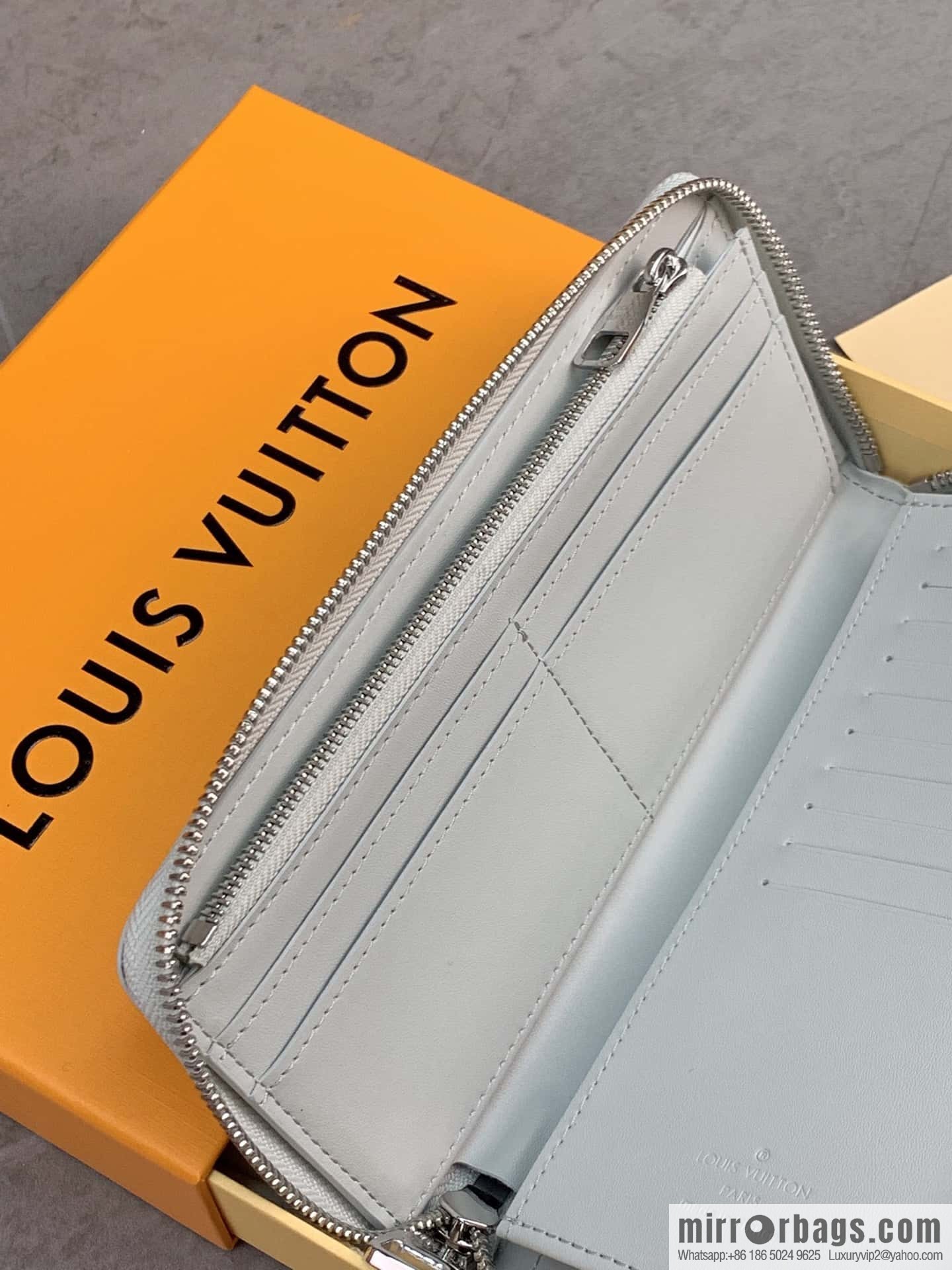 LV M82597 Zippy Vertical Wallet