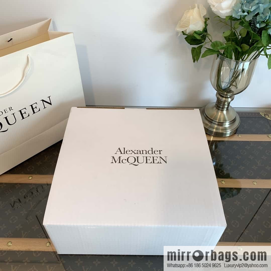 Alexander McQueen, platform black and white Chelsea booties