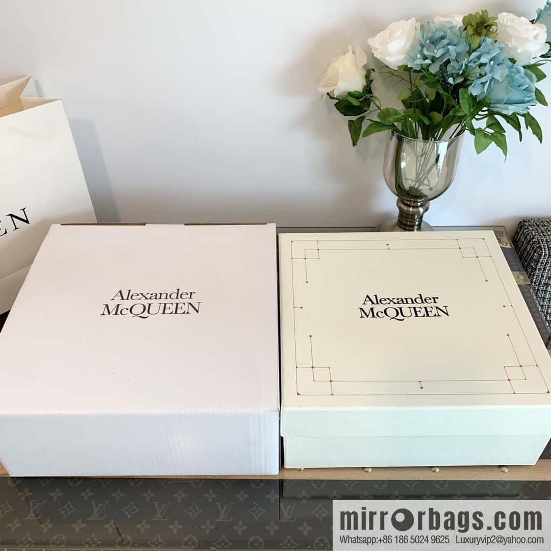 Alexander McQueen, platform black and white Chelsea booties