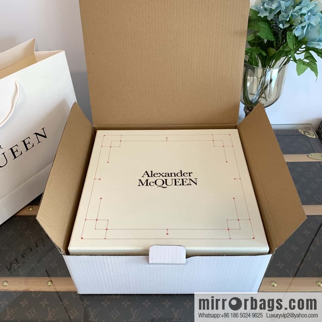 Alexander McQueen, platform black and white Chelsea booties