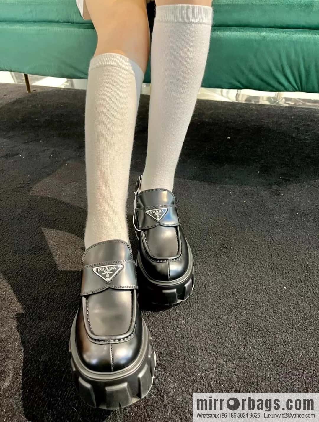 PRADA Prada, triangular label, serrated wheel muffin platform loafers 1D246M