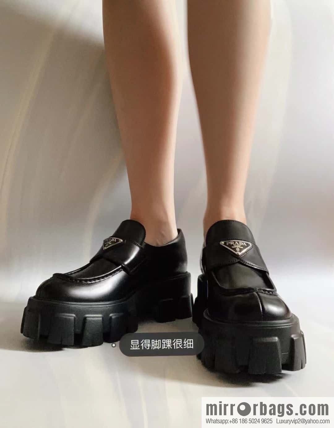 PRADA Prada, triangular label, serrated wheel muffin platform loafers 1D246M