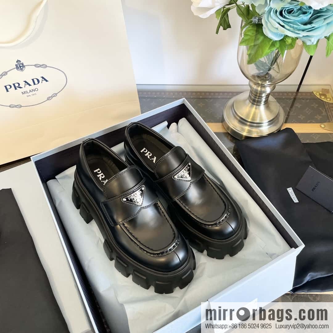 PRADA Prada, triangular label, serrated wheel muffin platform loafers 1D246M