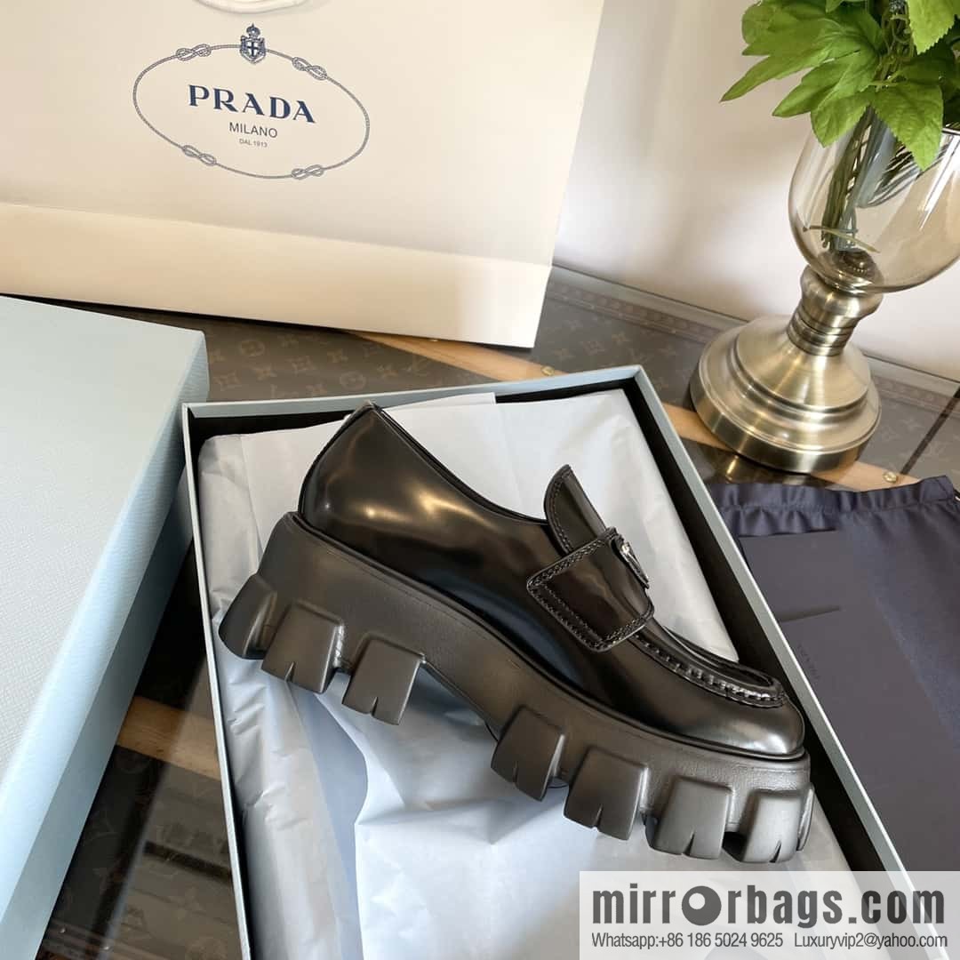 PRADA Prada, triangular label, serrated wheel muffin platform loafers 1D246M