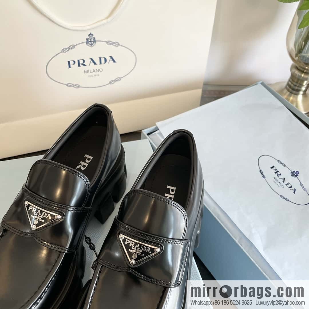 PRADA Prada, triangular label, serrated wheel muffin platform loafers 1D246M