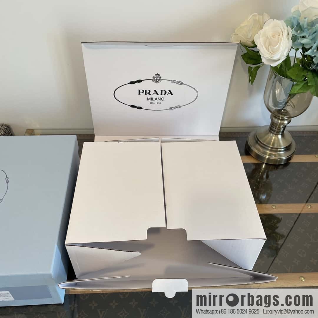 PRADA Prada, triangular label, serrated wheel muffin platform loafers 1D246M