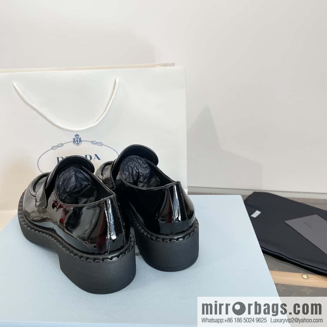 Prada, Puhada glossy patent leather triangle loafers
