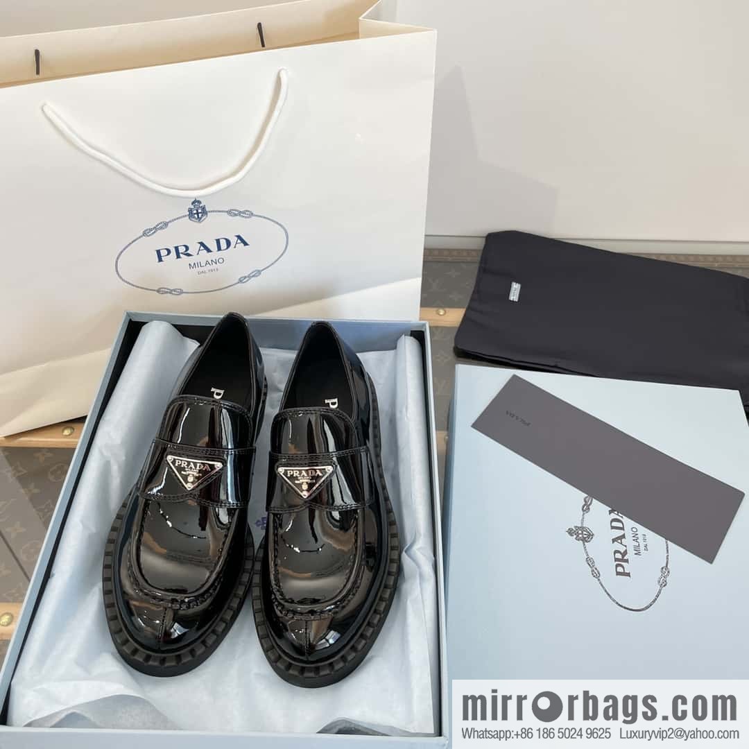 Prada, Puhada glossy patent leather triangle loafers