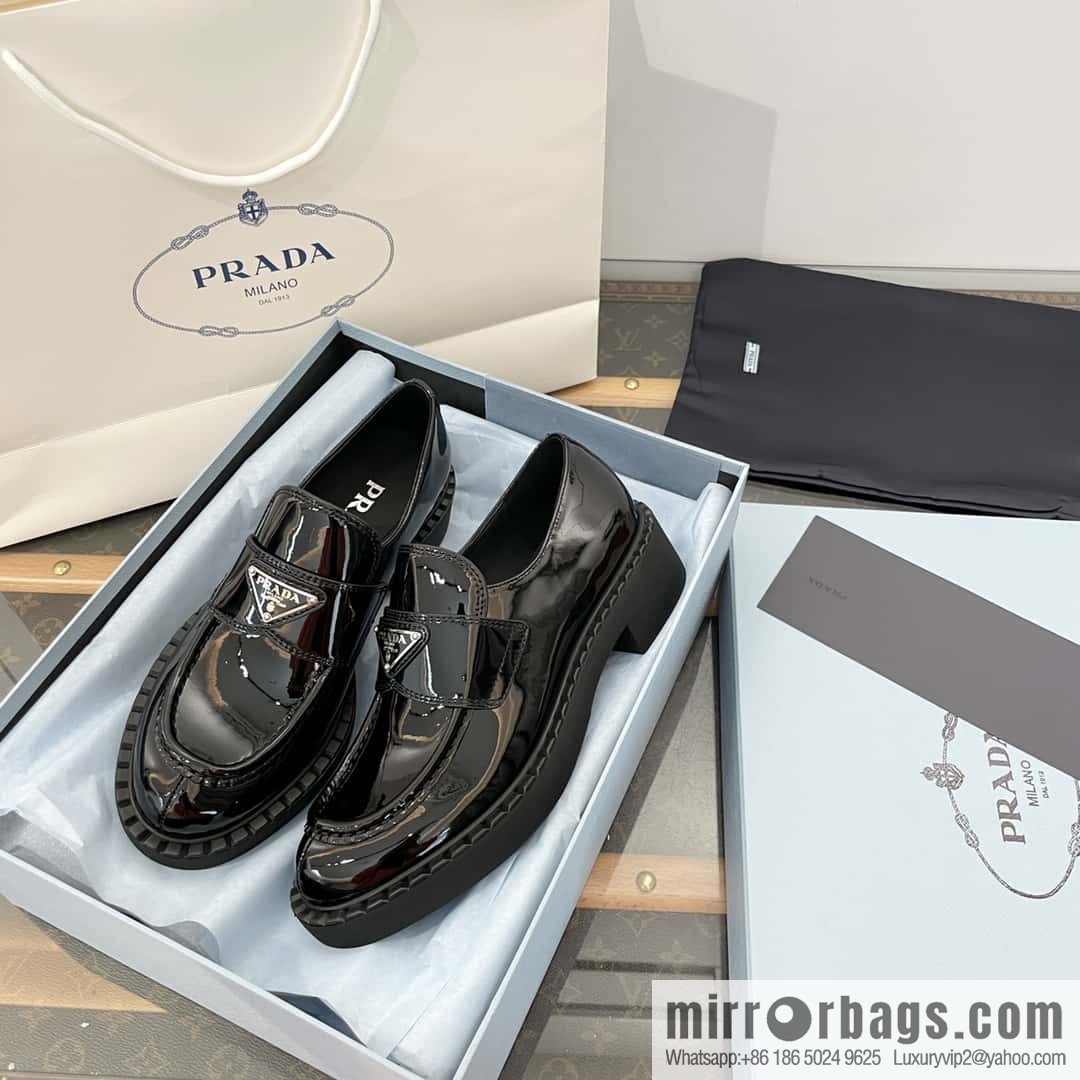 Prada, Puhada glossy patent leather triangle loafers