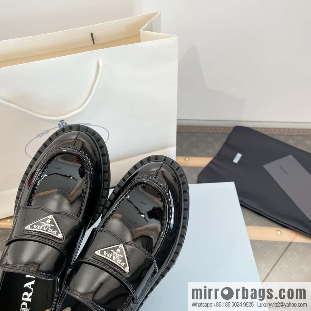 Prada, Puhada glossy patent leather triangle loafers