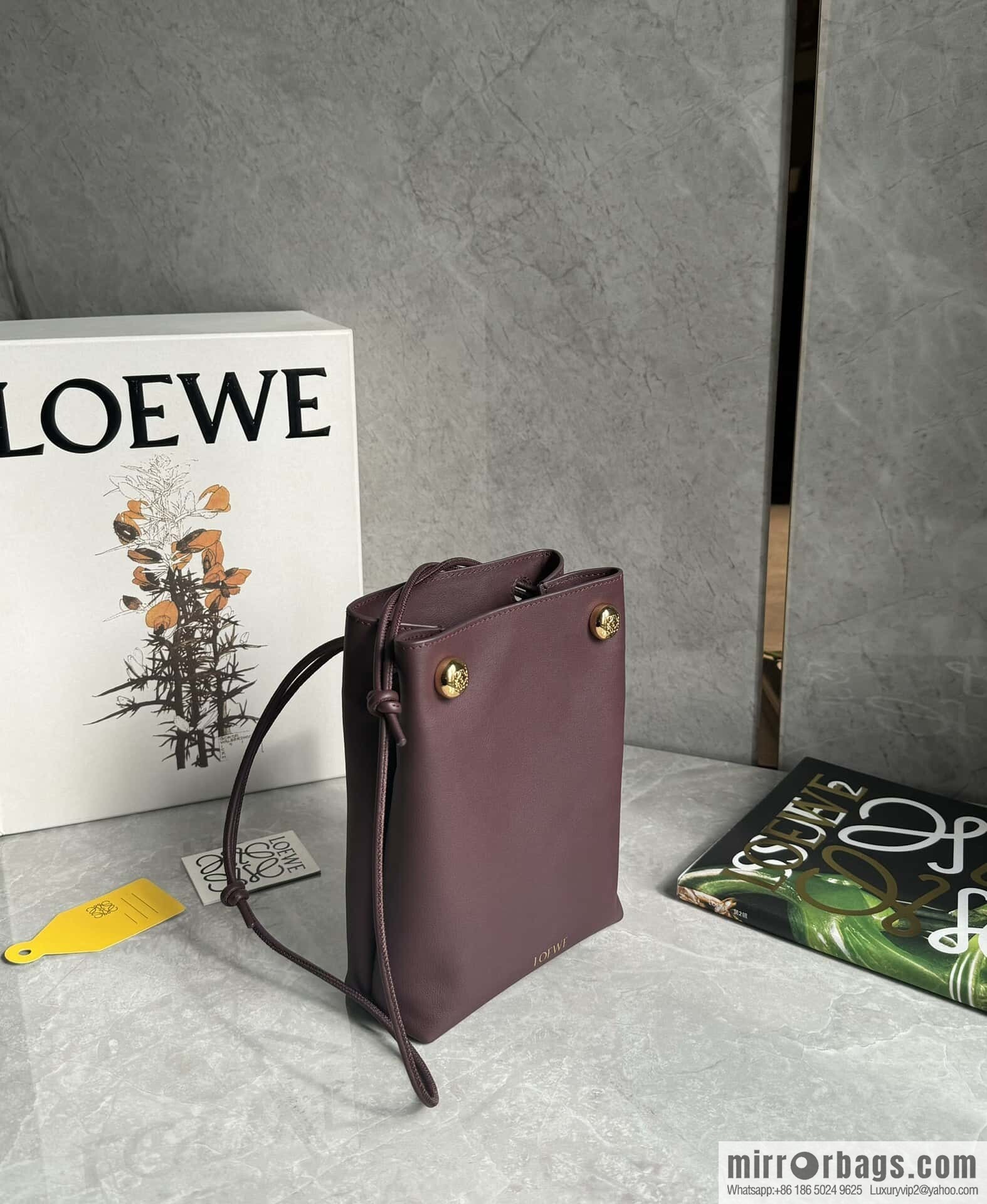 LOEWE's new Pebble Pouch 0905 burgundy