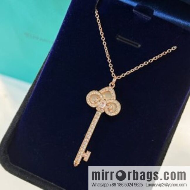 TIFFANY & CO. Tiffany & Co. Fleur de Lis white shell key pendant necklace