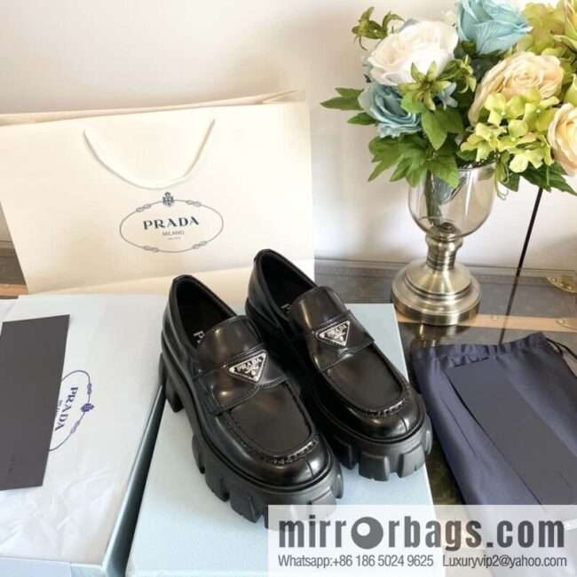 PRADA Prada, triangular label, serrated wheel muffin platform loafers 1D246M